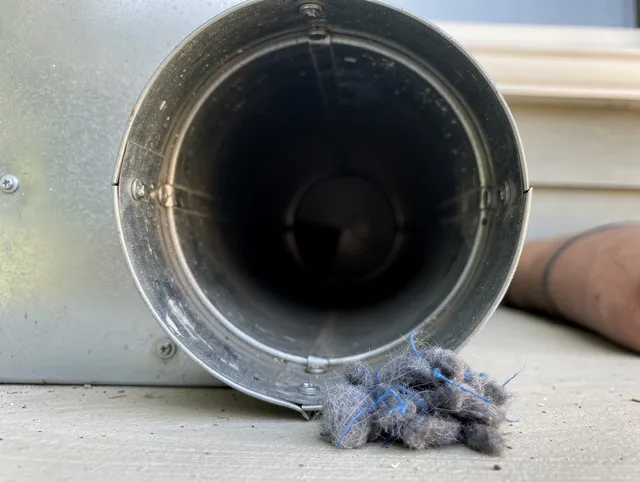 Walnut Dryer Vent Cleaning technician using specialized equipment to clear severe dryer vent blockage in Walnut